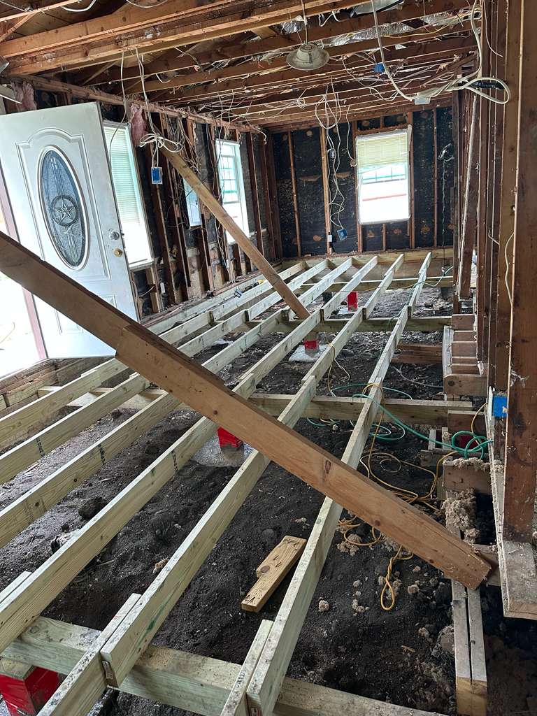 New floor joist system installed during structural repairs